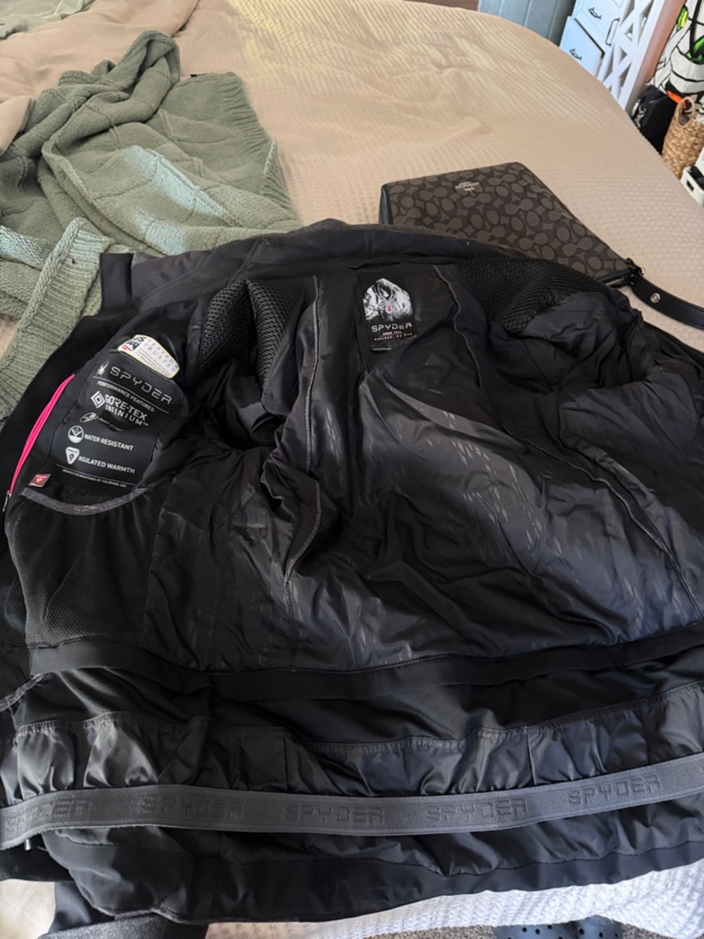 Spyder Men’s Black Ski Jacket with Subtle Pink Trim